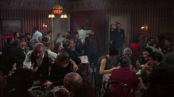 Movie still from “Barefoot in the Park” (1967), directed by Gene Saks – A group of people sitting at tables in a room; Wide shot, High angle