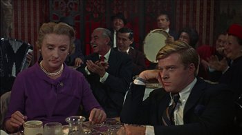 Movie still from “Barefoot in the Park” (1967), directed by Gene Saks – A group of people sitting around a table; Medium shot, Over the shoulder angle