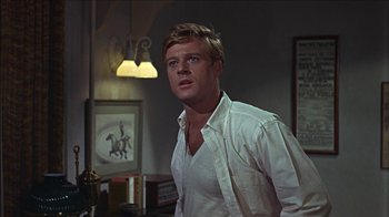 Movie still from “Barefoot in the Park” (1967), directed by Gene Saks – A man standing in a room with a white shirt on; Close Up shot, Low angle