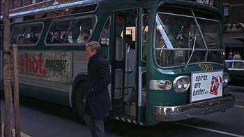 Movie still from “Barefoot in the Park” (1967), directed by Gene Saks – A man in a black coat walking next to a green bus; Wide shot, Over the shoulder angle