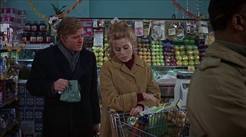 Movie still from “Barefoot in the Park” (1967), directed by Gene Saks – A woman is pushing a shopping cart in a grocery store; Medium shot, Over the shoulder angle