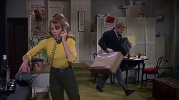 Movie still from “Barefoot in the Park” (1967), directed by Gene Saks – A man and a woman in a room with a phone; Wide shot, High angle