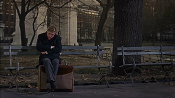Movie still from “Barefoot in the Park” (1967), directed by Gene Saks – A woman sitting on a bench next to a tree; Wide shot, High angle