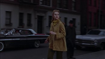 Movie still from “Barefoot in the Park” (1967), directed by Gene Saks – A woman walking down the street in a yellow coat; Medium shot, Low angle