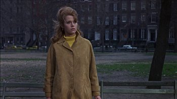 Movie still from “Barefoot in the Park” (1967), directed by Gene Saks – A woman in a yellow coat standing on a bench; Medium shot, Low angle