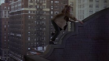 Movie still from “Barefoot in the Park” (1967), directed by Gene Saks – A man riding a skateboard down the side of a building; Wide shot, Overhead angle