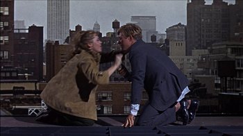 Movie still from “Barefoot in the Park” (1967), directed by Gene Saks – A man and a woman fighting on top of a building; Medium shot, Over the shoulder angle