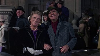 Movie still from “Barefoot in the Park” (1967), directed by Gene Saks – An older man and woman posing for a picture; Medium shot, Low angle