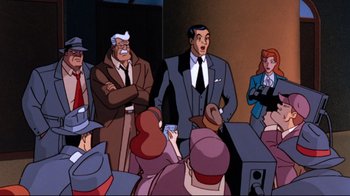 Movie still from “Batman: Mask of the Phantasm” (1993), directed by Kevin Altieri – A group of people sitting in a room; Medium shot, High angle