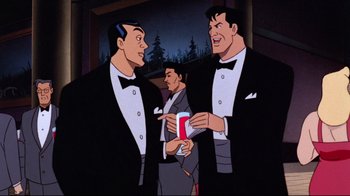 Movie still from “Batman: Mask of the Phantasm” (1993), directed by Kevin Altieri – Two men in tuxedos are talking to another man in a suit; Medium shot, Over the shoulder angle