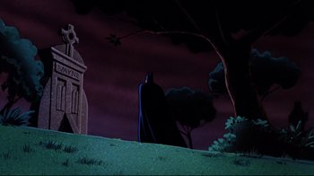 Movie still from “Batman: Mask of the Phantasm” (1993), directed by Kevin Altieri – A bat standing in the middle of a graveyard; Wide shot, Low angle