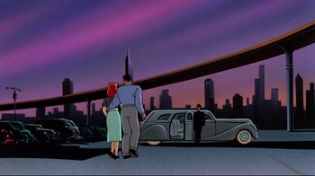 Movie still from “Batman: Mask of the Phantasm” (1993), directed by Kevin Altieri – Two people standing in front of a car in a city; Wide shot, Low angle