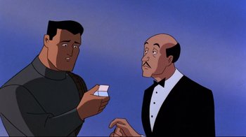 Movie still from “Batman: Mask of the Phantasm” (1993), directed by Kevin Altieri – Two men in suits are looking at each other; Medium shot, Over the shoulder angle