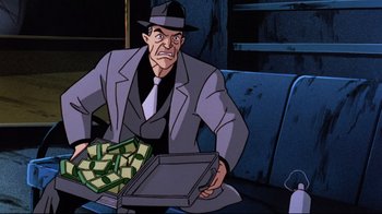 Movie still from “Batman: Mask of the Phantasm” (1993), directed by Kevin Altieri – A man in a suit and hat holding a box of money; Medium shot, Over the shoulder angle
