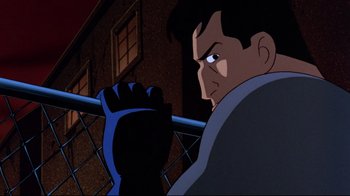 Movie still from “Batman: Mask of the Phantasm” (1993), directed by Kevin Altieri – A man with a blue and black glove is looking over a railing; Close Up shot, Low angle