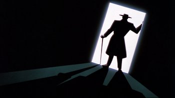 Movie still from “Batman: Mask of the Phantasm” (1993), directed by Kevin Altieri – A shadow of a man with a hat and a cane standing in front of an open door; Wide shot, Low angle