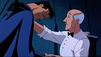 Movie still from “Batman: Mask of the Phantasm” (1993), directed by Kevin Altieri – A man in a white shirt and a man in a black tie; Medium shot, Over the shoulder angle