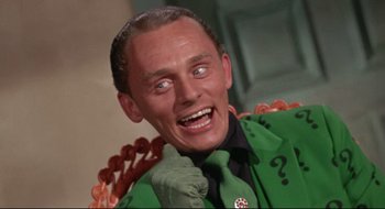 Movie still from “Batman: The Movie” (1966), directed by Leslie H. Martinson – A person wearing a suit and tie; Close Up shot, Low angle