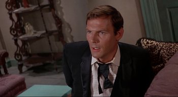 Movie still from “Batman: The Movie” (1966), directed by Leslie H. Martinson – A person wearing a suit and a tie; Close Up shot, High angle