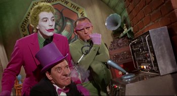 Movie still from “Batman: The Movie” (1966), directed by Leslie H. Martinson – A group of people standing next to each other in a room; Medium shot, Low angle