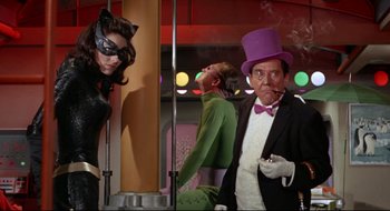Movie still from “Batman: The Movie” (1966), directed by Leslie H. Martinson – A group of people standing next to each other in a room; Medium shot, Low angle