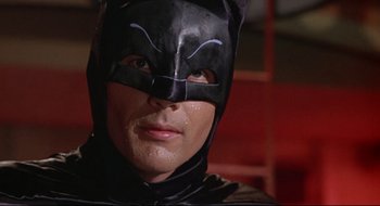 Movie still from “Batman: The Movie” (1966), directed by Leslie H. Martinson – A person wearing a batman mask; Close Up shot, Low angle