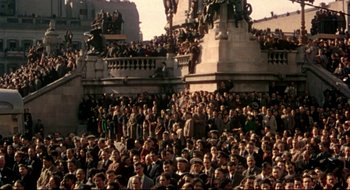 Movie still from “Batman: The Movie” (1966), directed by Leslie H. Martinson – A crowd of people standing in front of a building; Extreme Wide shot, High angle