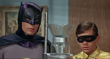 Movie still from “Batman: The Movie” (1966), directed by Leslie H. Martinson – Two people dressed as batman and a batgirl; Medium shot, Low angle