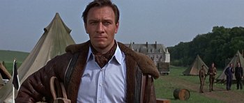 Movie still from “The Battle of Britain” (1969), directed by Guy Hamilton – A person wearing a shirt and tie; Close Up shot, Low angle