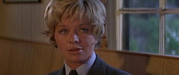 Movie still from “The Battle of Britain” (1969), directed by Guy Hamilton – A person wearing a suit and tie; Close Up shot, Low angle