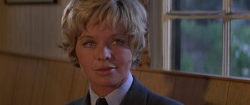 Movie still from “The Battle of Britain” (1969), directed by Guy Hamilton – A person wearing a suit and tie; Close Up shot, Low angle