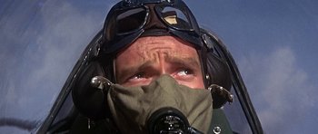 Movie still from “The Battle of Britain” (1969), directed by Guy Hamilton – A person wearing goggles and a mask; Close Up shot, Low angle
