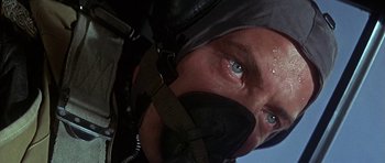 Movie still from “The Battle of Britain” (1969), directed by Guy Hamilton – A man's face in a helmet; Close Up shot, Low angle