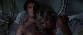 Movie still from “The Battle of Britain” (1969), directed by Guy Hamilton – A man and a woman laying in a bed; Close Up shot, Low angle