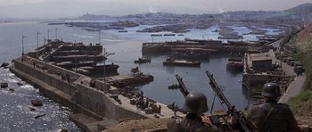 Movie still from “The Battle of Britain” (1969), directed by Guy Hamilton – An image of an old time war scene in the middle of the day; Extreme Wide shot, High angle