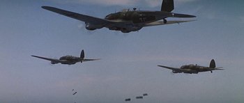 Movie still from “The Battle of Britain” (1969), directed by Guy Hamilton – A group of planes flying in the sky; Extreme Wide shot, Low angle