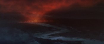 Movie still from “The Battle of Britain” (1969), directed by Guy Hamilton – A red and orange sky over a large body of water; Extreme Wide shot, High angle