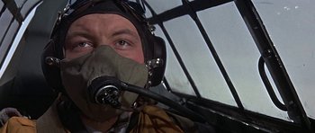Movie still from “The Battle of Britain” (1969), directed by Guy Hamilton – A person wearing a mask; Close Up shot, Low angle