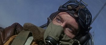 Movie still from “The Battle of Britain” (1969), directed by Guy Hamilton – A person wearing a gas mask; Close Up shot, Low angle