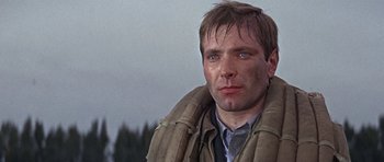 Movie still from “The Battle of Britain” (1969), directed by Guy Hamilton – A person wearing a jacket; Close Up shot, Low angle