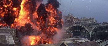 Movie still from “The Battle of Britain” (1969), directed by Guy Hamilton – An explosion is seen in the background of this picture; Extreme Wide shot, High angle