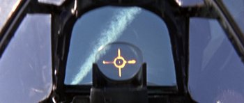 Movie still from “The Battle of Britain” (1969), directed by Guy Hamilton – A view from a plane of a plane flying in the sky; Extreme Close Up shot, Low angle