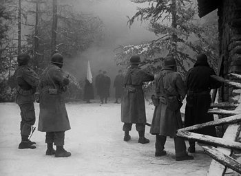 Movie still from “Battleground” (1949), directed by William A. Wellman – A black and white photo of a group of men standing in the snow; Wide shot, Low angle