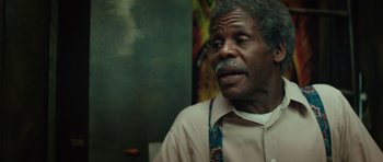 Movie still from “Be Kind Rewind” (2008), directed by Michel Gondry – An older man wearing a brown shirt and a colorful tie; Close Up shot, Over the shoulder angle