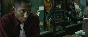 Movie still from “Be Kind Rewind” (2008), directed by Michel Gondry – A man sitting in front of a refrigerator; Close Up shot, Over the shoulder angle