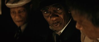 Movie still from “Be Kind Rewind” (2008), directed by Michel Gondry – An older man wearing a suit and a hat; Close Up shot, Low angle
