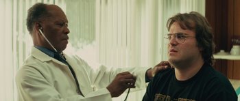 Movie still from “Be Kind Rewind” (2008), directed by Michel Gondry – A doctor is checking a patient's blood pressure; Close Up shot, Over the shoulder angle