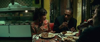 Movie still from “Be Kind Rewind” (2008), directed by Michel Gondry – A man and a woman sitting at a table with plates of food; Medium shot, Over the shoulder angle