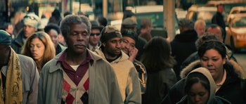 Movie still from “Be Kind Rewind” (2008), directed by Michel Gondry – A group of men standing next to each other on the street; Medium shot, Over the shoulder angle