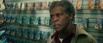 Movie still from “Be Kind Rewind” (2008), directed by Michel Gondry – An older man is looking into the camera; Close Up shot, Over the shoulder angle